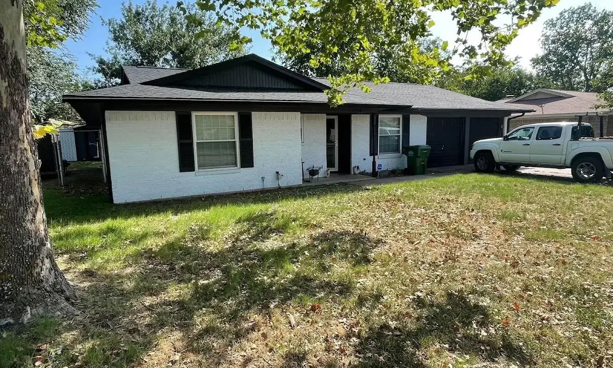 Professional roofing crew working on a residential roof in Evansville